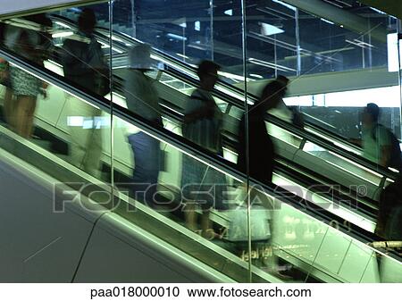 People riding escalator, blurred motion View Large Photo Image Stock Image - People riding escalator, blurred motion. Fotosearch