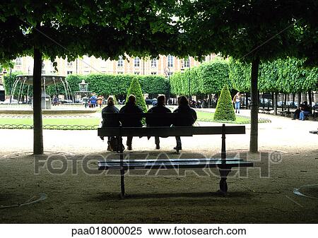 People sitting together on bench in park, rear view. View Large Photo Image Stock Photography - People sitting together on bench in park, rear view.. Fotosearch