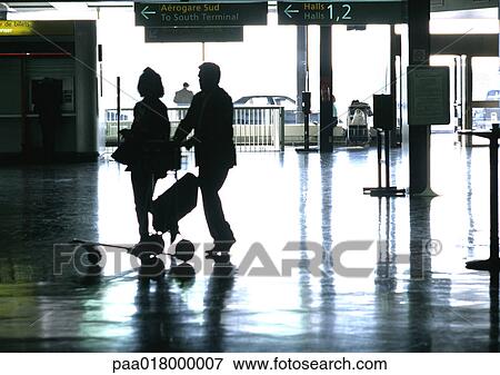 Stock Photo - People walking in train station, silhouette.. Fotosearch
