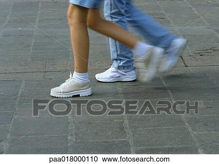 People walking, lower section, blurred motion View Large Photo Image Stock Image - People walking, lower section, blurred motion. Fotosearch