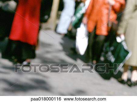 Stock Photograph - People with shopping bags, blurred.. Fotosearch