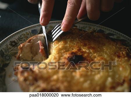 Person cutting into casserole. View Large Photo Image Stock Image - Person cutting into casserole.. Fotosearch