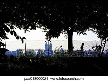 Person running in park, silhouette. View Large Photo Image Stock Image - Person running in park, silhouette.. Fotosearch