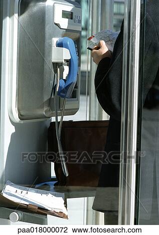 Person using pay phone. View Large Photo Image Stock Image - Person using pay phone.. Fotosearch
