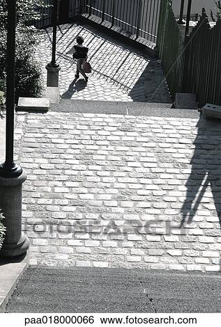 Person walking on cobblestone street, view from above. View Large Photo Image Stock Photograph - Person walking on cobblestone street, view from above.. Fotosearch