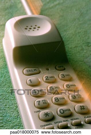 Stock Photography - Portable phone on floor, blurred close up.. Fotosearch