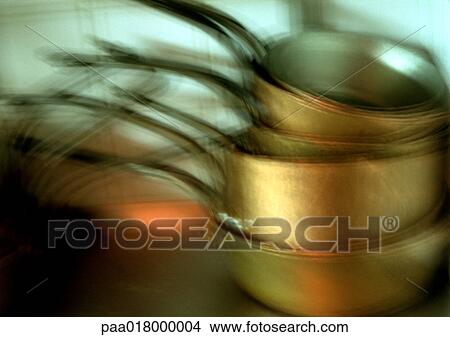 Stacked pots and pans, blurred View Large Photo Image Picture - Stacked pots and pans, blurred. Fotosearch
