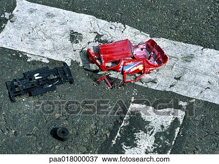 Toy car smashed in road. View Large Photo Image Stock Photo - Toy car smashed in road.. Fotosearch