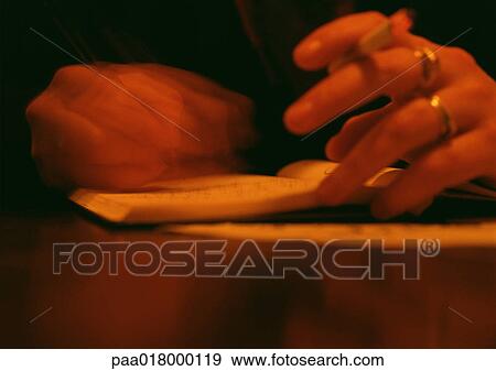 Woman holding cigarette in hand, blurred close up. View Large Photo Image Stock Photo - Woman holding cigarette in hand, blurred close up.. Fotosearch