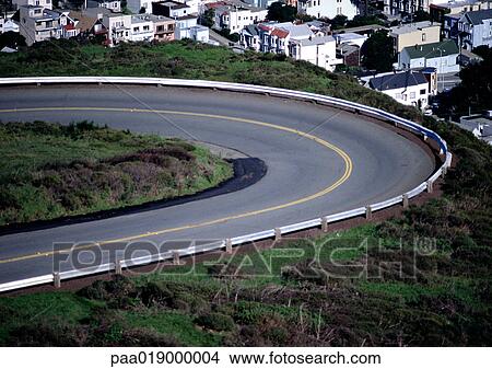 Curve of road with houses below. View Large Photo Image Picture - Curve of road with houses below.. Fotosearch