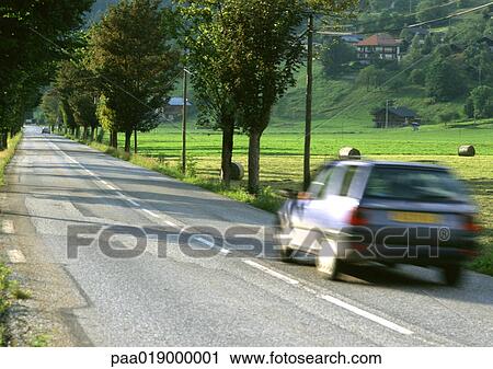 Fast moving car on road, blurred motion View Large Photo Image Stock Image - Fast moving car on road, blurred motion. Fotosearch
