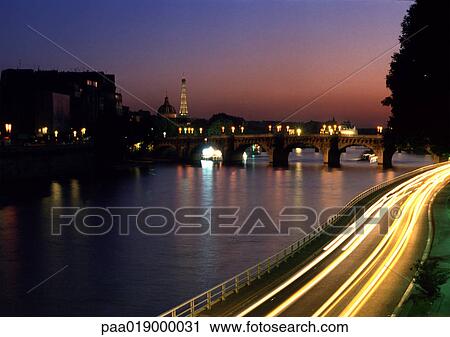 France, Paris, cars traveling on quai next to River Seine at night, blurry. View Large Photo Image Stock Image - France, Paris, cars traveling on quai next to River Seine at night, blurry.. Fotosearch