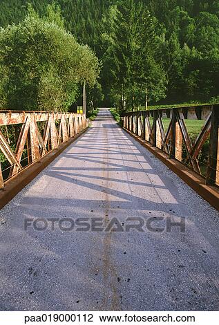 France, Savoie, bridge leading into woods. View Large Photo Image Stock Image - France, Savoie, bridge leading into woods.. Fotosearch