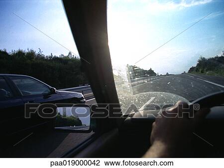 View through windshield onto road. View Large Photo Image Stock Image - View through windshield onto road.. Fotosearch