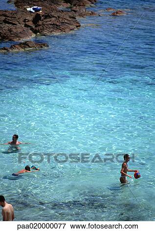 Corsica, people wading in sea View Large Photo Image Stock Photo - Corsica, people wading in sea. Fotosearch