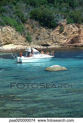 France, Corsica, boat in sea near coast View Large Photo Image Picture - France, Corsica, boat in sea near coast. Fotosearch