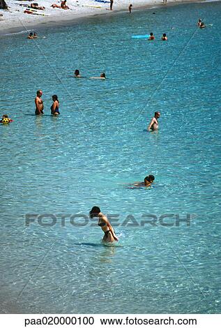People wading in sea View Large Photo Image Stock Image - People wading in sea. Fotosearch