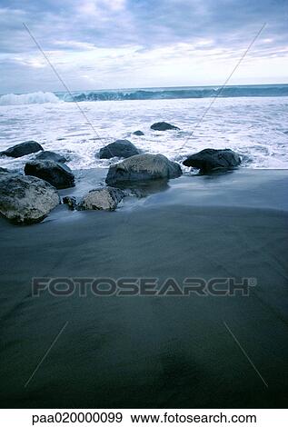 Stock Photo - Sand and surf, close-up. Fotosearch