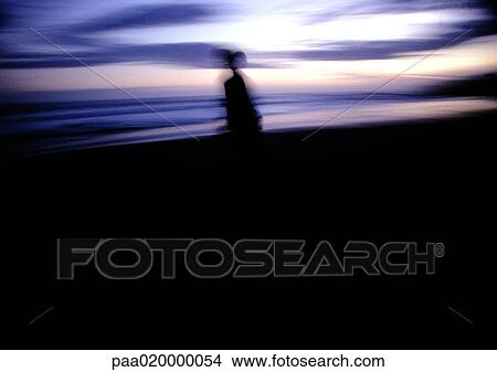 Picture - Silhouette at sunset, blurred. Fotosearch