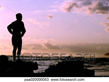 Silhouette of person standing, looking at sea at sunset View Large Photo Image Stock Image - Silhouette of person standing, looking at sea at sunset. Fotosearch
