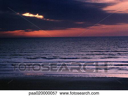 Stock Photo - Sunset over sea. Fotosearch