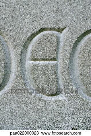 Stock Image - E, text, etched.. Fotosearch
