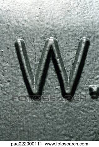 Stock Image - W, text, engraved. Fotosearch