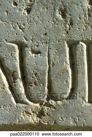 Stock Image - W, text, etched.. Fotosearch