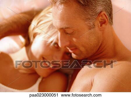 Couple lying together. View Large Photo Image Stock Image - Couple lying together.. Fotosearch