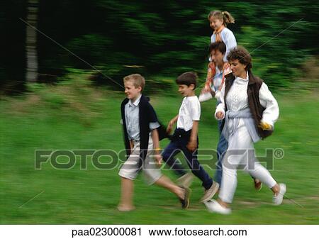 Family running together outside, blurred. View Large Photo Image Stock Image - Family running together outside, blurred.. Fotosearch