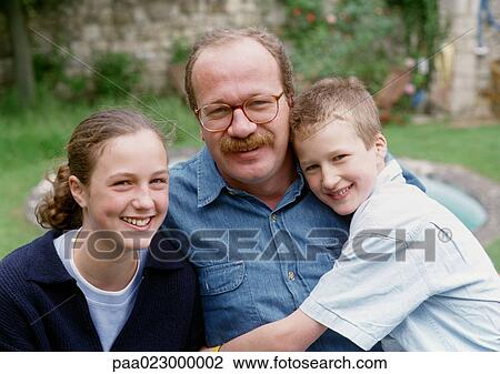 Father posing with son and daughter outside, portrait. View Large Photo Image Stock Image - Father posing with son and daughter outside, portrait.. Fotosearch