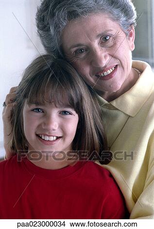 Picture - Girl and senior woman facing camera, smiling, portrait.. Fotosearch