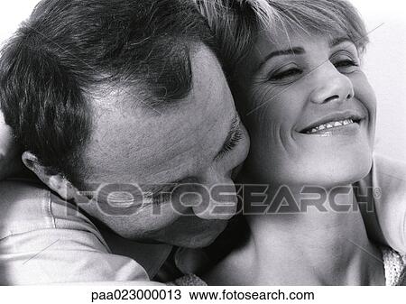 Man hugging woman from behind, close up, black and white. View Large Photo Image Stock Image - Man hugging woman from behind, close up, black and white.. Fotosearch