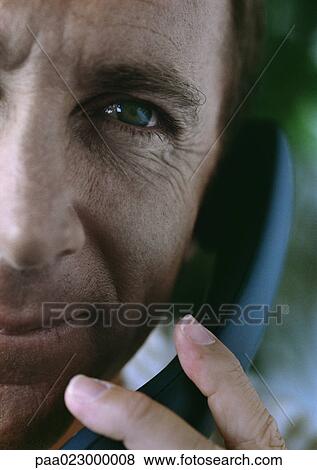 Stock Photo - Man on telephone, cropped.. Fotosearch