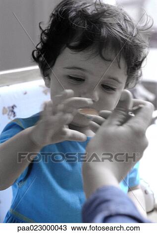 Person feeding young child. View Large Photo Image Stock Image - Person feeding young child.. Fotosearch