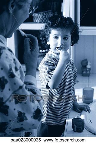Senior and child brushing teeth together in bathroom, black and white. View Large Photo Image Stock Photography - Senior and child brushing teeth together in bathroom, black and white.. Fotosearch