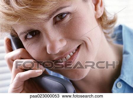Woman on telephone facing camera. View Large Photo Image Stock Image - Woman on telephone facing camera.. Fotosearch