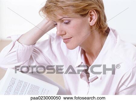 Woman reading, side view. View Large Photo Image Stock Image - Woman reading, side view.. Fotosearch