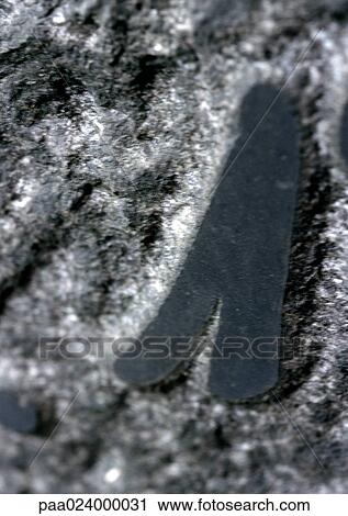 Stock Image - 1 text, on stone.. Fotosearch