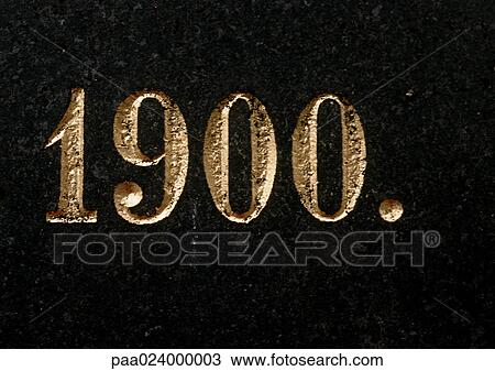 Stock Image - 1900 text, embossed in gold. Fotosearch