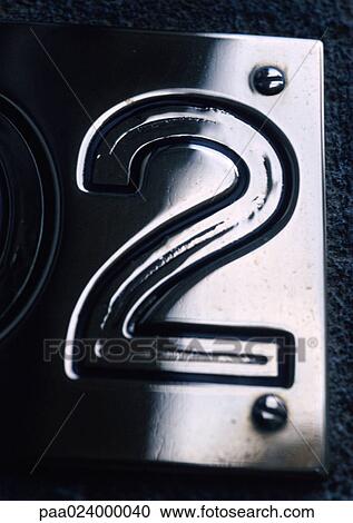 Stock Image - 2 text, embossed in metal plate. Fotosearch