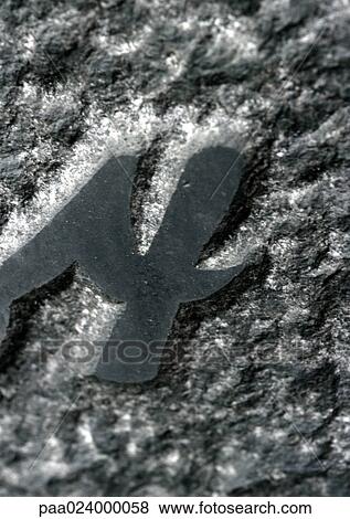 Stock Photo - 4 text, raised on stone surface. Fotosearch