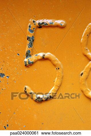 Stock Image - 5 text embossed on chipped orange surface. Fotosearch