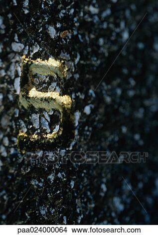 Picture - 5 text, embossed on rough surface. Fotosearch