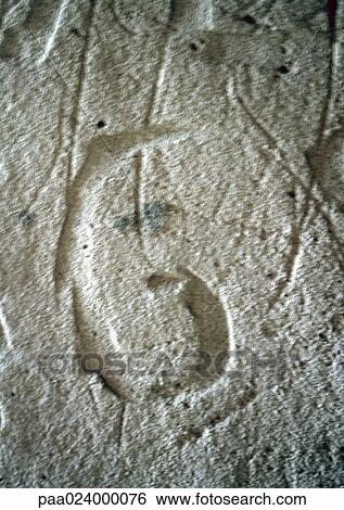 Stock Photograph - 6 text, carved in stone.. Fotosearch