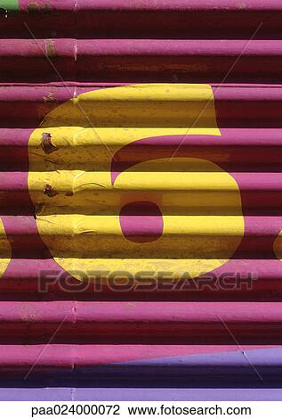 Stock Image - 6 text, painted on roller shutter. Fotosearch