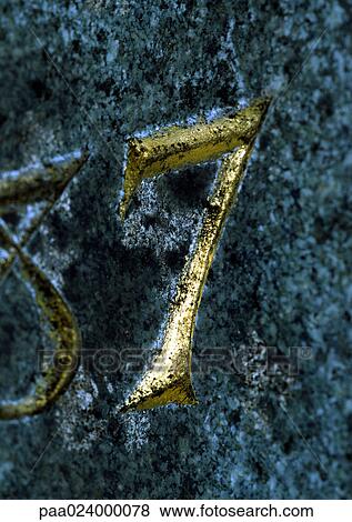 Stock Photo - 7 text, embossed in gold. Fotosearch