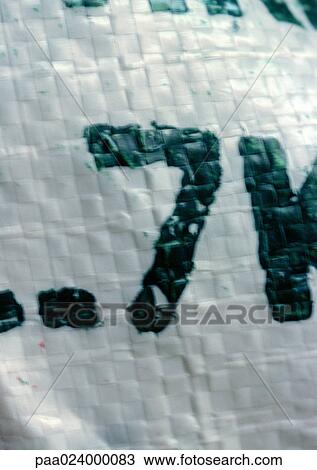 Stock Image - 7 text, painted on woven plastic surface. Fotosearch