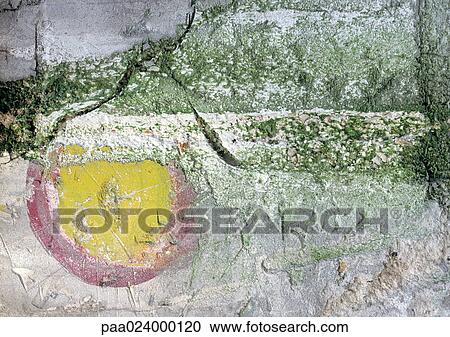 Stock Image - . text, painted on flaking surface. Fotosearch