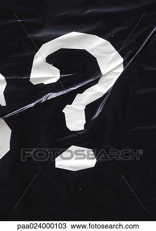 Stock Image - ? text, printed in white on wrinkled black surface. Fotosearch